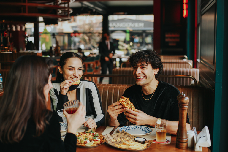 Friends Eating and Drinking in Restaurant